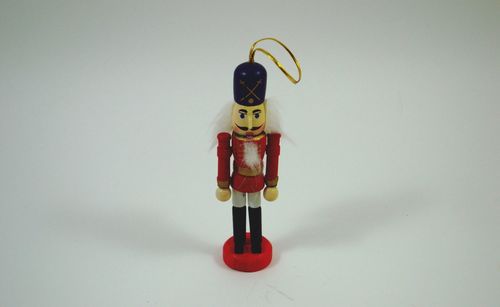 Close-up of toy hanging against white background