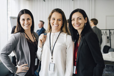 Portrait of female entrepreneurs standing at workplace