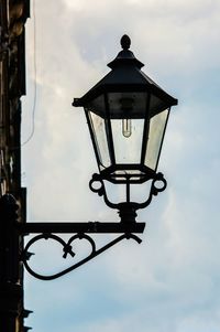 Low angle view of street light against sky