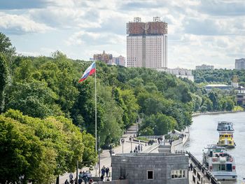 High angle view of bridge by river in city on sunny day at gorky park