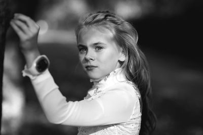 Portrait of girl standing outdoors