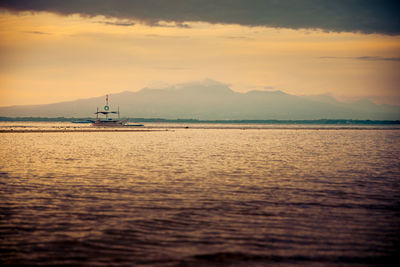 Calm waters at sunrise in beautiful clouds formation.