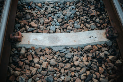 High angle view of stones on railroad track