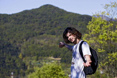 Portrait of smiling male hiker during sunny day