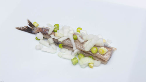 High angle view of chopped vegetables against white background