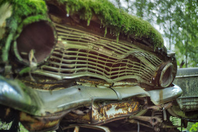 Close-up of rusty abandoned car