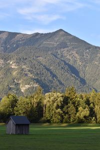 Scenic view of landscape and mountains against sky