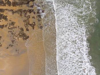 Close-up of water splashing on rocks