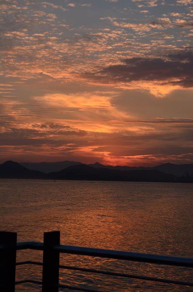 sunset, water, tranquil scene, scenics, tranquility, sky, beauty in nature, lake, nature, orange color, silhouette, idyllic, cloud - sky, mountain, sea, cloud, rippled, river, calm, reflection