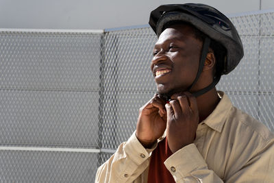 Portrait of a smiling young man looking away