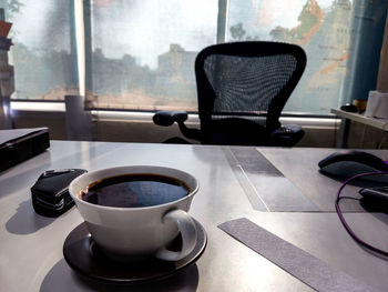 Close-up of coffee cup on table