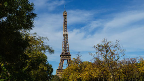 Low angle view of tower against cloudy sky