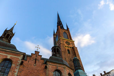 Low angle view of church against blue sky