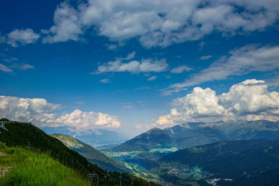 Scenic view of mountains against cloudy sky