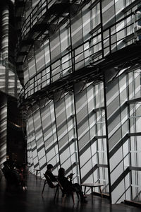Low angle view of man walking on escalator