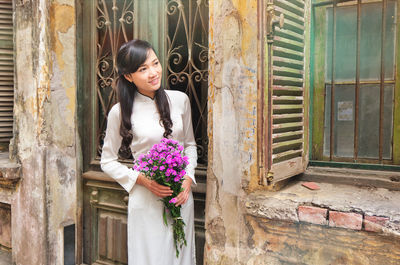 Young vietnamese girl wearing ao dai dress.