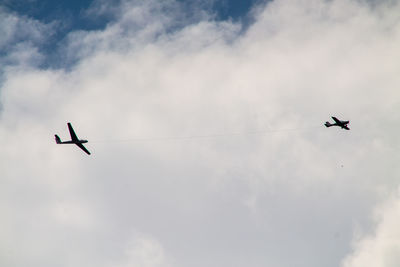 Low angle view of airplane flying in sky