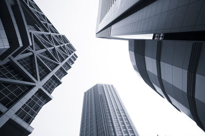 Low angle view of modern buildings against clear sky
