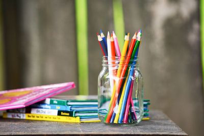 Close-up of multi colored school supplies on table