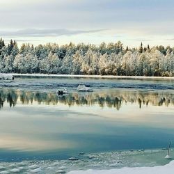 Scenic view of frozen lake against sky