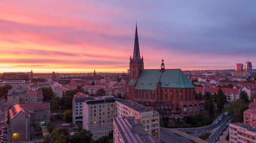 Cityscape against sky during sunset