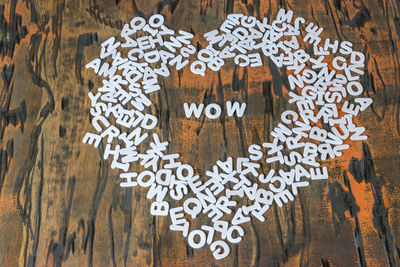 Close-up of heart shape alphabets on table 