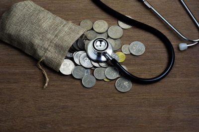 High angle view of coins on table