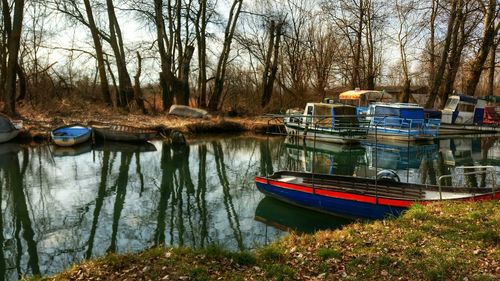 Boats moored in lake