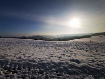 Scenic view of snowcapped mountains against sky during winter