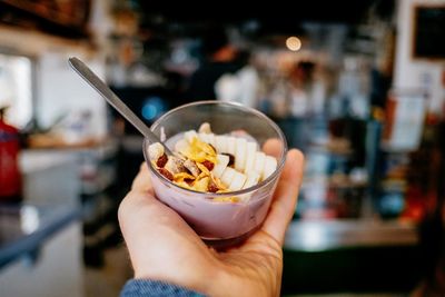 Close-up of hand holding ice cream