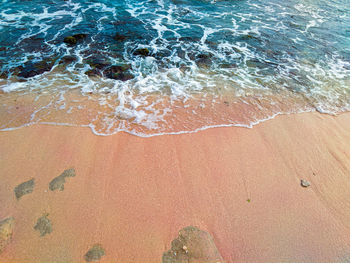 High angle view of surf on beach