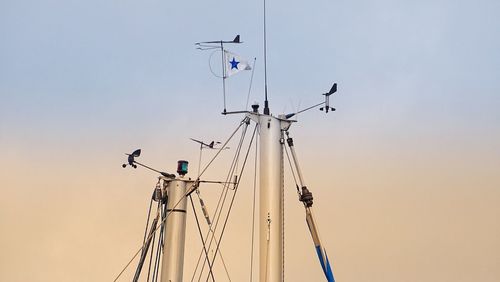 Low angle view of mast against clear sky during sunset