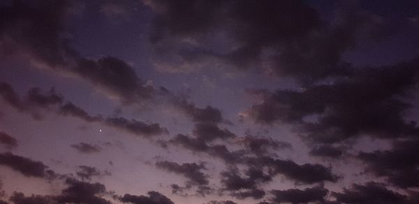 Low angle view of dramatic sky at dusk