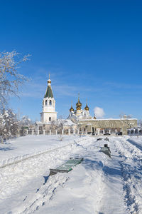 Building against sky during winter