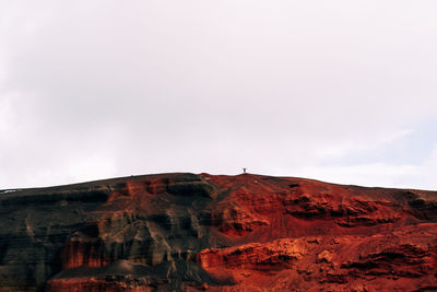 Rock formations on mountain against sky