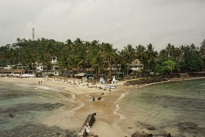 View of beach against cloudy sky