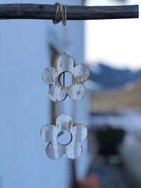 Close-up of chain hanging on wood