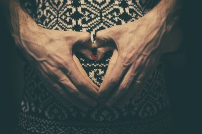 Close-up of couple holding hands