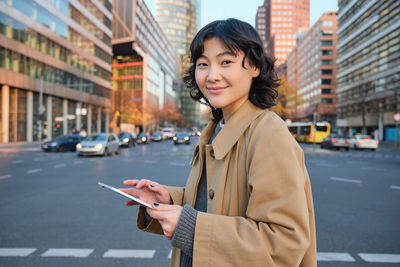 Young woman standing in city