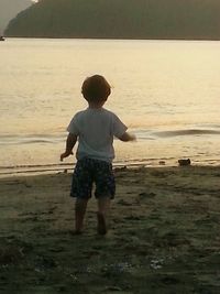 Full length of woman standing on shore