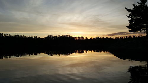 Scenic view of lake at sunset