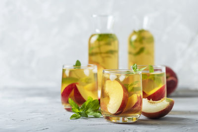 Fruits in glass on table