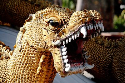 Close-up of dragon statue at temple