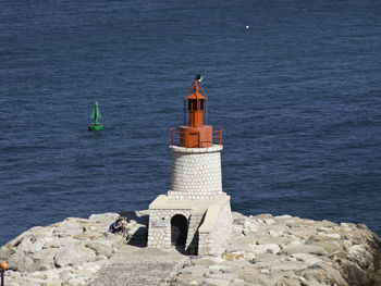 High angle view of lighthouse by sea