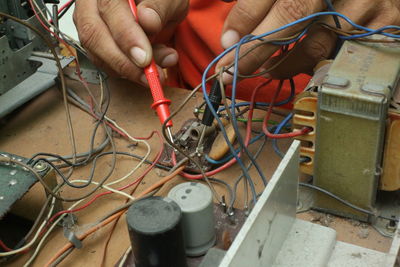 Cropped hands of man working in workshop