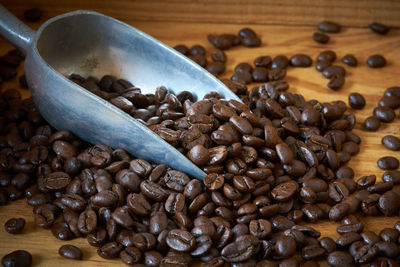 Close-up of roasted coffee beans on table