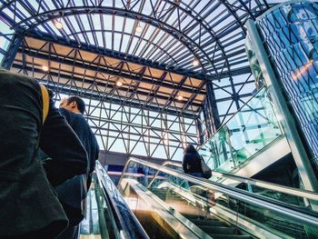 Low angle view of people on escalator in rho fiera railway station