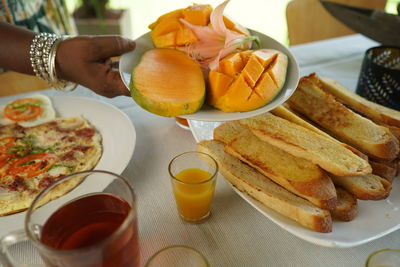 Close-up of breakfast served on table mango 