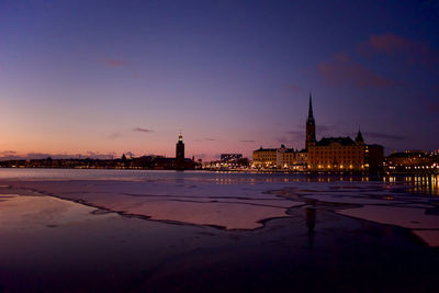 View of illuminated city at sunset