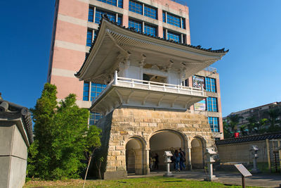 Low angle view of historical building against clear blue sky